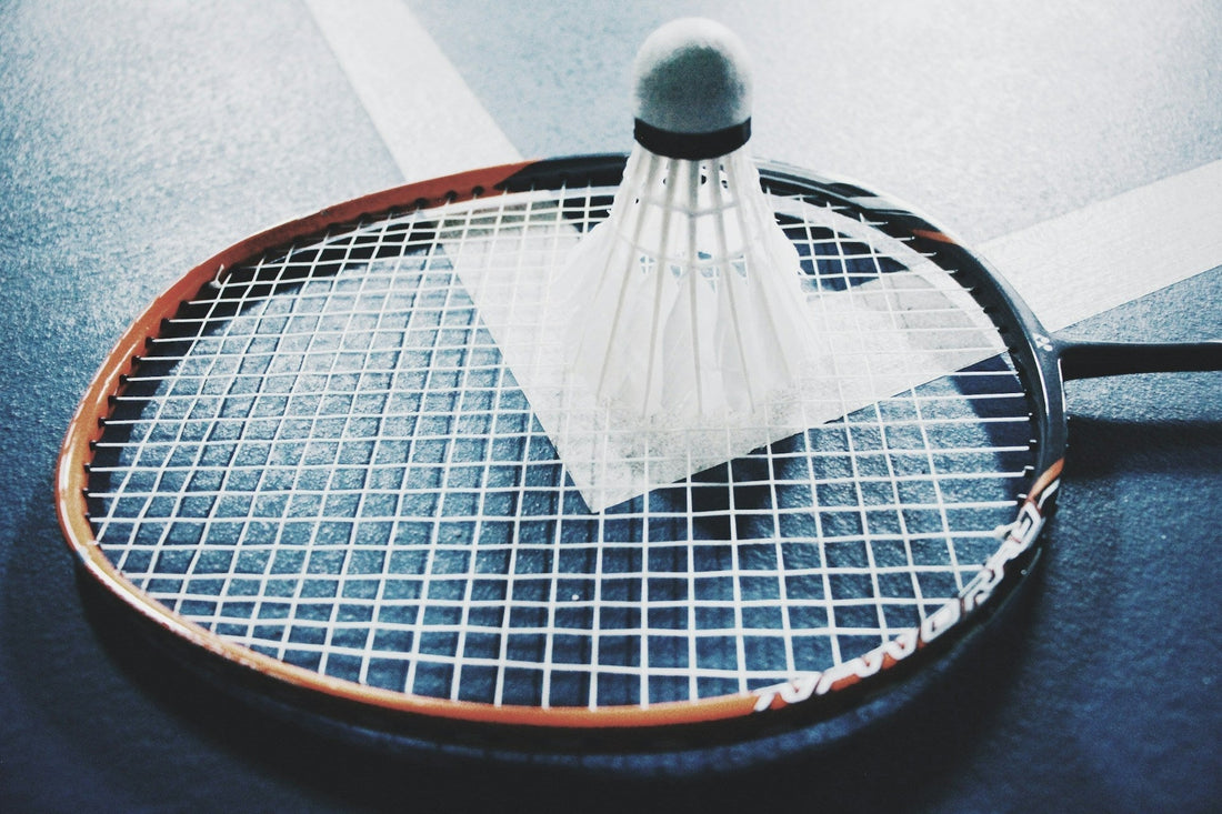 Close-up of badminton racquet strings being restrung — guide to restringing tension and costs for Australian players