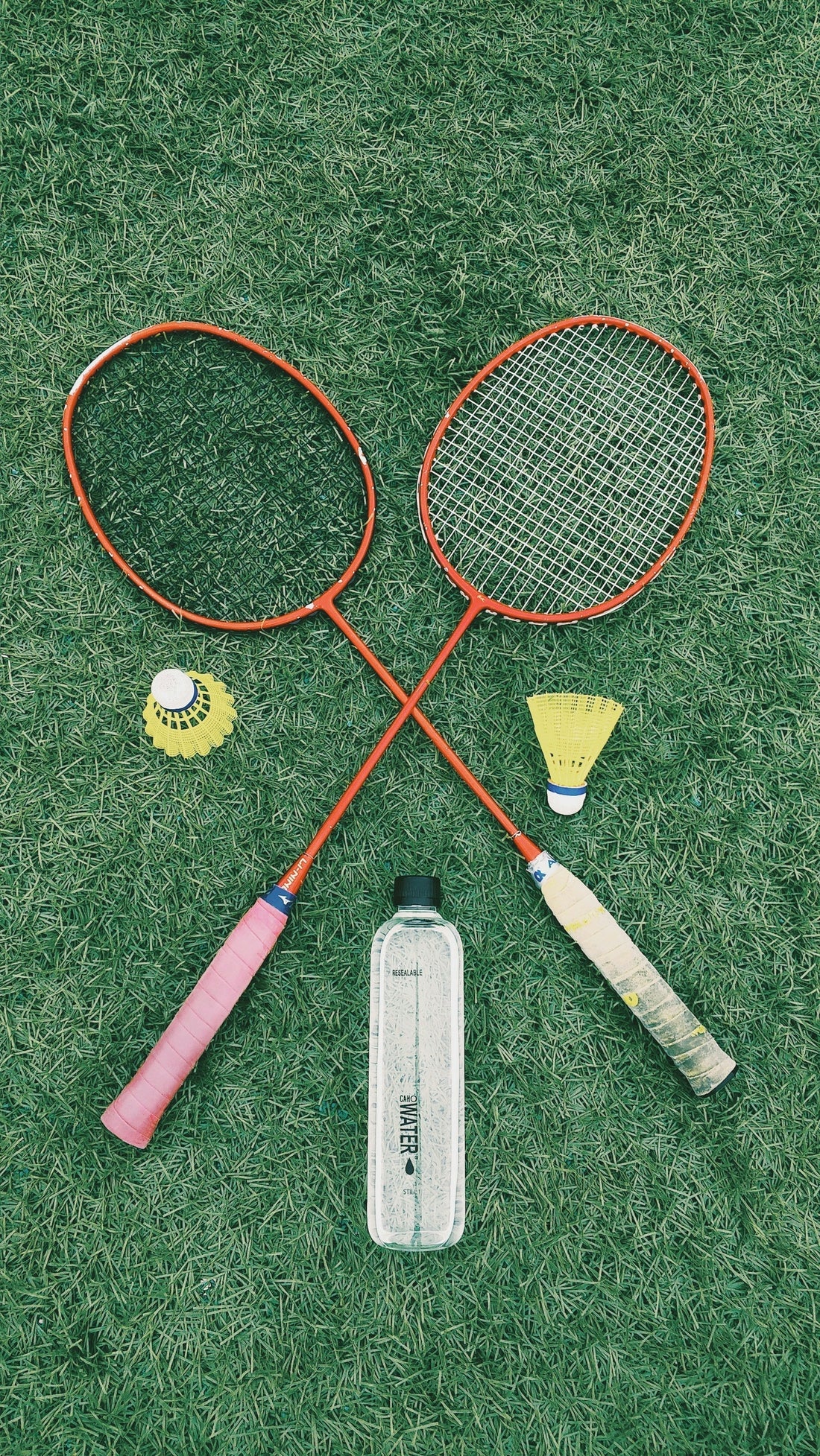 Badminton racquet and squash racquet side by side showing key differences in weight, head size, strings and shaft design