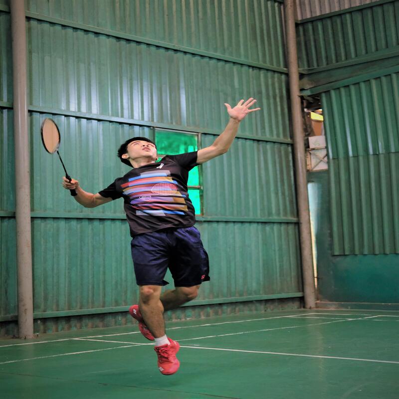 Badminton player executing a powerful smash on court — Yonex head-heavy Astrox racquets for power and attacking play