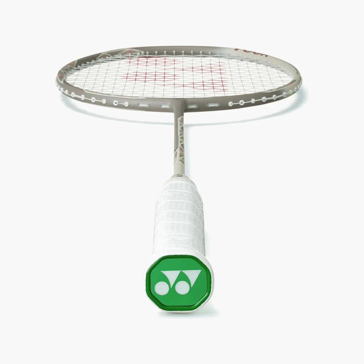 Angled view of the Yonex Astrox 77 Tour badminton racquet head and grip, showing grey frame and green Yonex end-cap logo