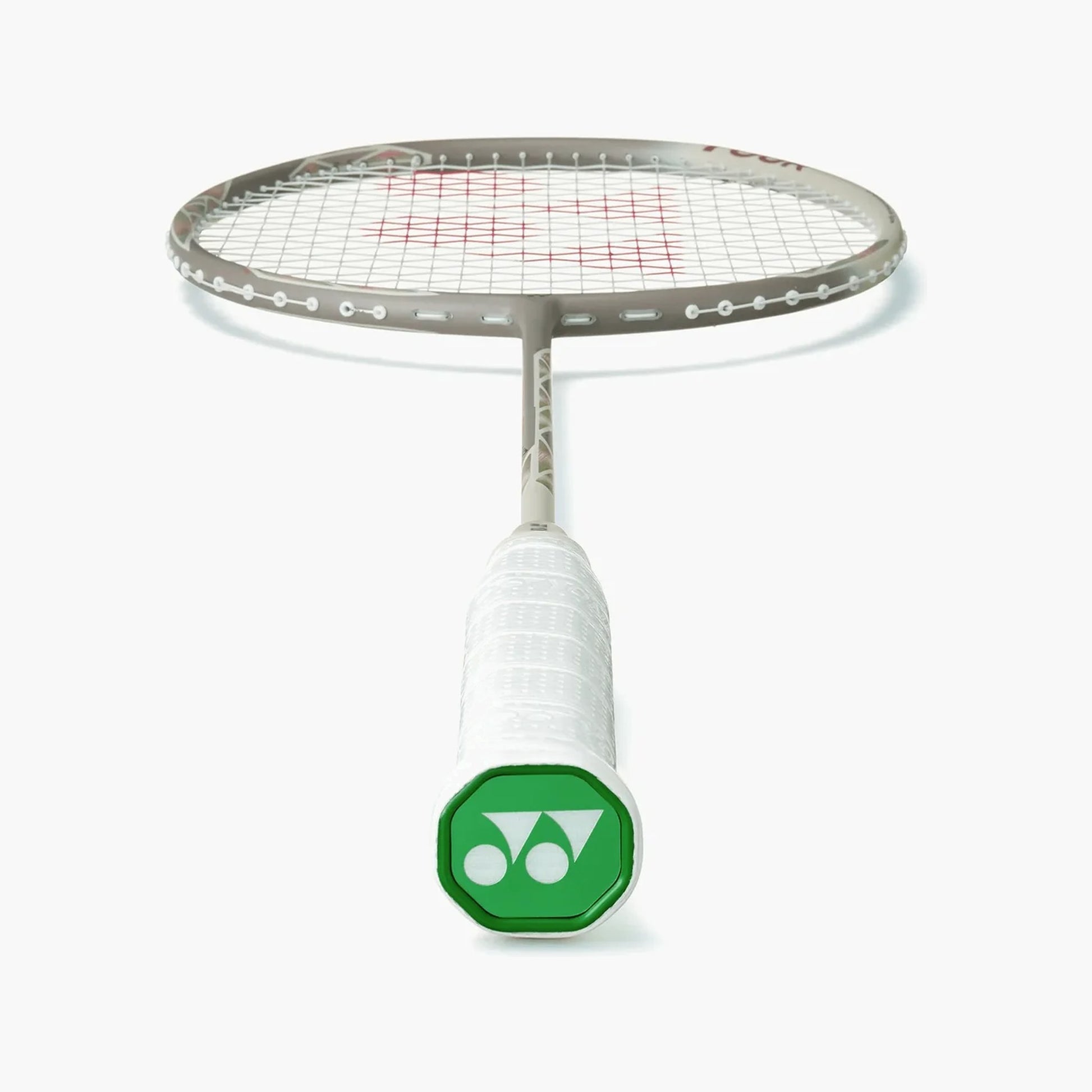 Angled view of the Yonex Astrox 77 Tour badminton racquet head and grip, showing grey frame and green Yonex end-cap logo