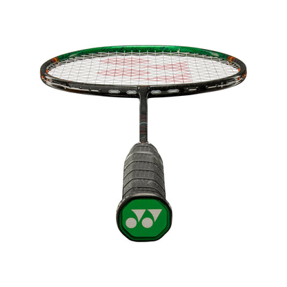 Angled view of the Yonex Astrox 99 Game badminton racquet head and grip, showing green frame top and green Yonex end-cap logo